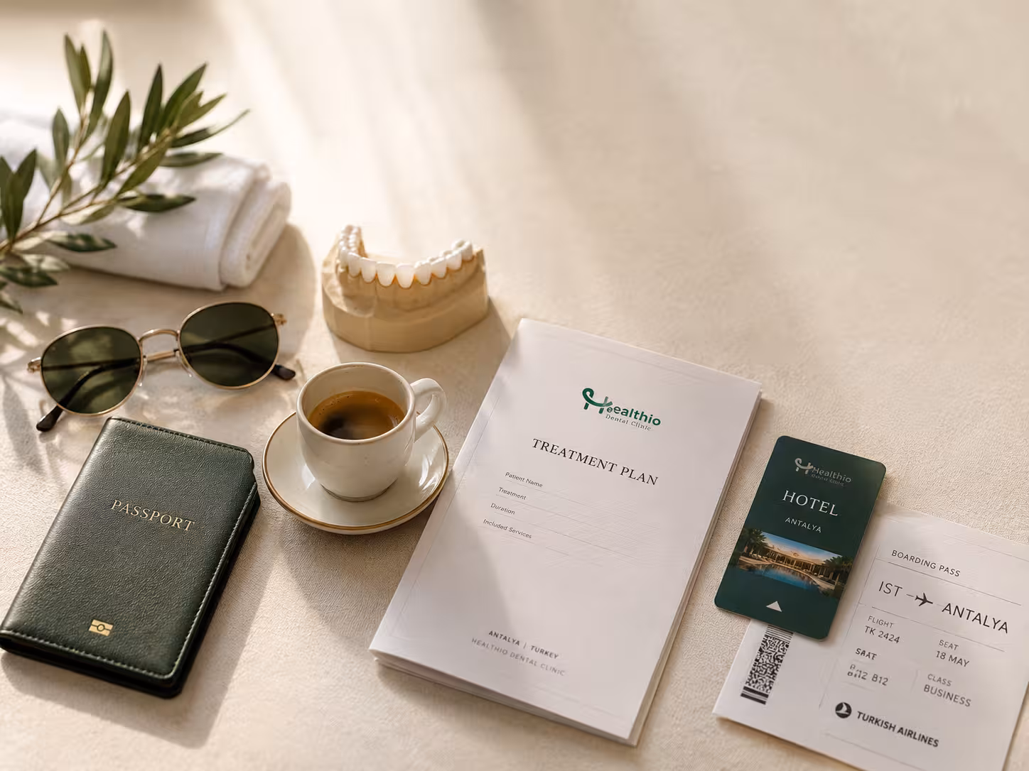 All-inclusive veneers Turkey package contents — treatment plan, hotel keycard, Antalya boarding pass and dental study model showing what is covered